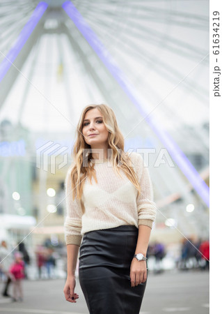 Gorgeus blonde woman in leather skirt posing on Gorgeus blonde woman in leather skirt posing on 61634219