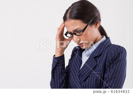 sick frustrated business woman with headache 61634832