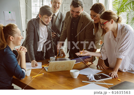 Group of young business professionals having a meeting, creative office 61635563