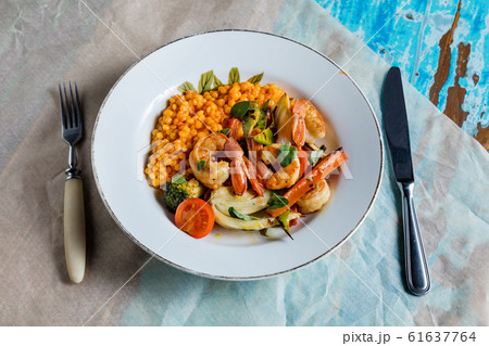 Shrimp with vegetables. The cuisine of Tel Aviv. 61637764