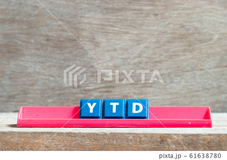 Tile letter on red rack in word YTD Tile letter on red rack in word YTD 61638780