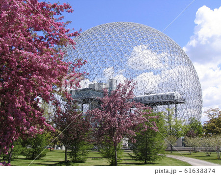 Biosphere of Montreal with pink cherry tree flowers on the foreground, Canada 61638874