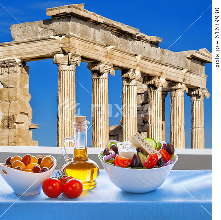 Famous Acropolis with Greek salad in Athens, Greece 61639930
