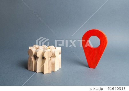 A crowd of people and a red pointer position. place to stay, travel and tourism. meeting place, evacuation point. The goal is to reach your destination. Mass transport system and infrastructure 61640313