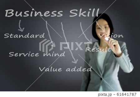businesswoman with pen writing on the 61641787