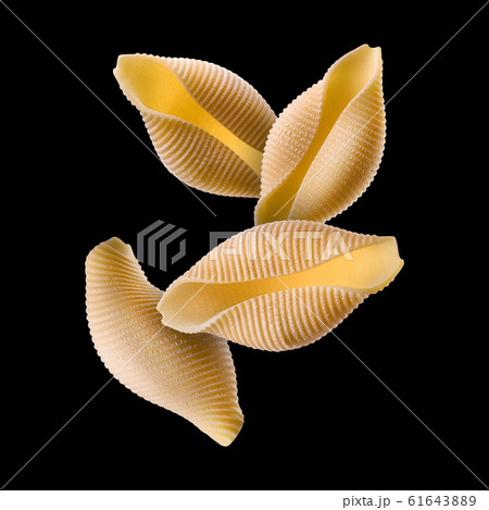 Conchiglie pasta shell composition isolated on black background 61643889