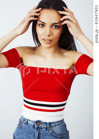 young happy smiling latin american teenage girl emotional posing on white background, lifestyle people concept young happy smiling latin american teenage girl emotional posing on white background, lifestyle people concept 61647901