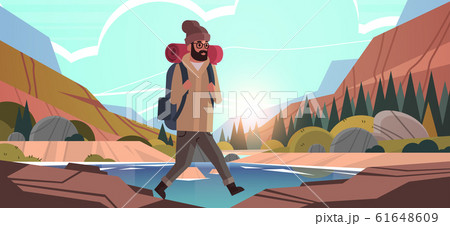 man traveler hiking with backpack travel lifestyle wanderlust adventure concept guy hiker walking outdoor rocky mountains sunset landscape background horizontal 61648609