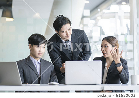 Business team discussing together in conference room during meeting at office. Business team discussing together in conference room during meeting at office. 61650603