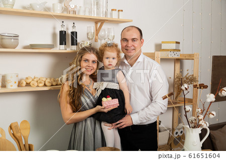 Happy family with a child in the kitchen in the 61651604