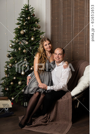 Beautiful and happy man and woman at the New Year 61651653
