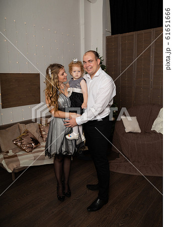 Beautiful young happy family with a child in her Beautiful young happy family with a child in her 61651666