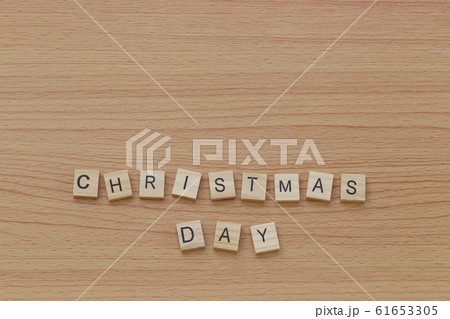 Christmas letters on a wooden floor and a copy space. 61653305