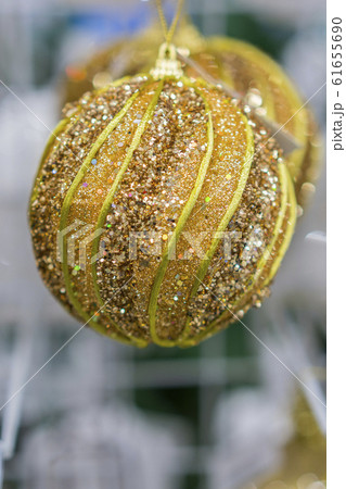 Yellow Christmas balls in a New Year's store. Yellow Christmas balls in a New Year's store. 61655690
