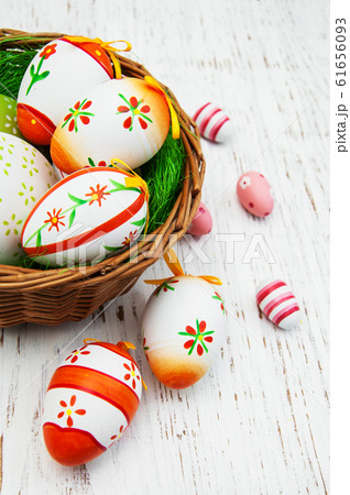 Easter eggs in a basket Easter eggs in a basket 61656093