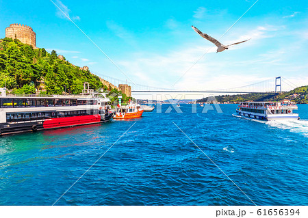 Ships in the Bosporus near the Sultan Fatih Mehmet Bridge and the Rumeli Hisar , Istanbul, Turkey 61656394