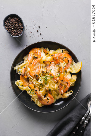 Pasta reginelle with seafood, shrimps, mussels Pasta reginelle with seafood, shrimps, mussels 61657054