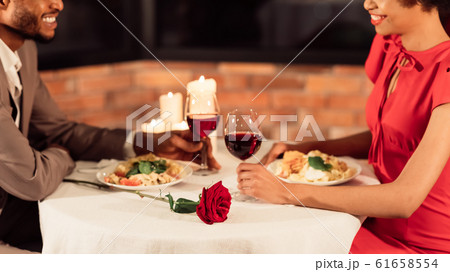 Black Spouses Having Romantic Date Eating In Restaurant, Panorama, Cropped 61658554