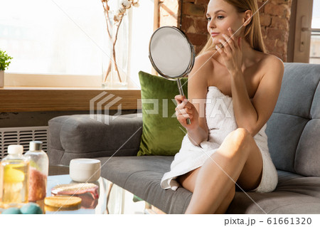 Beauty Day. Woman doing her daily skincare routine at home 61661320