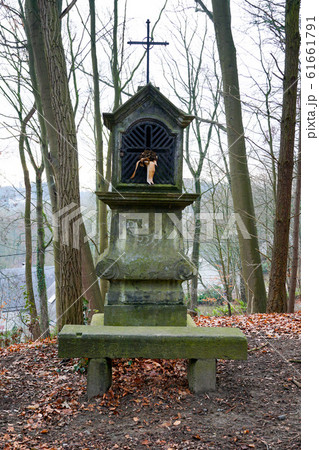 Typical old Christian wayside shrine at a country little forest Typical old Christian wayside shrine at a country little forest 61661791