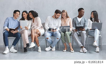 Young cheerful international people waiting for job interview 61661814
