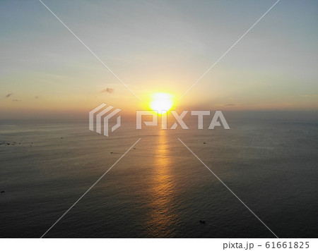 Sunset over the ocean in Bali 61661825