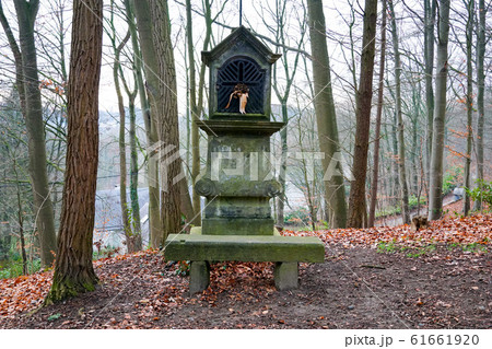 Typical old Christian wayside shrine at a country little forest Typical old Christian wayside shrine at a country little forest 61661920