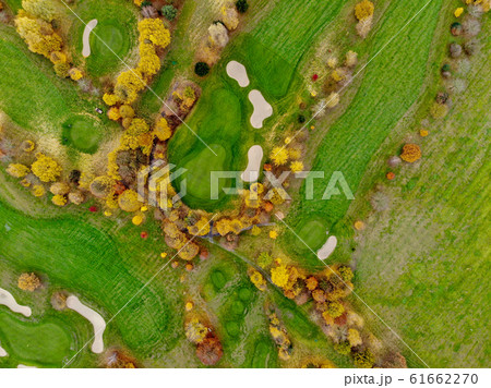 Aerial view of a golf course during autumn season 61662270
