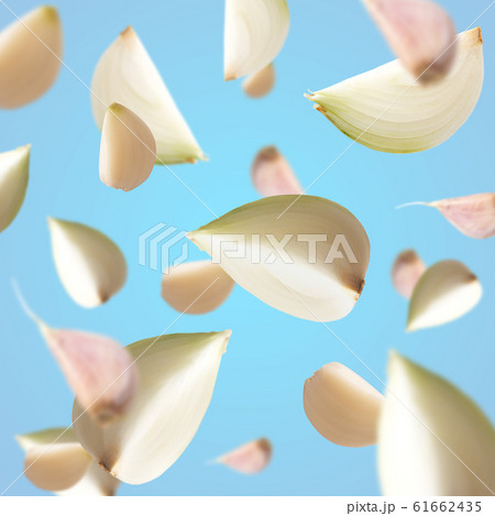 Fresh flying onion over white background, isolated 61662435