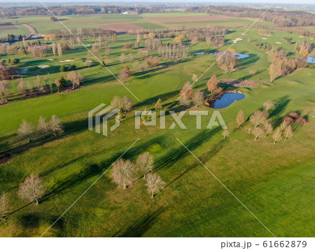 Aerial view of a golf course during autumn season 61662879