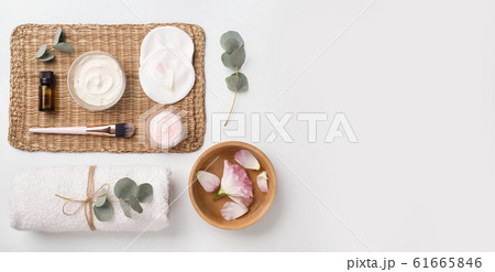 Spa composition of natural materials and rose petals on white 61665846
