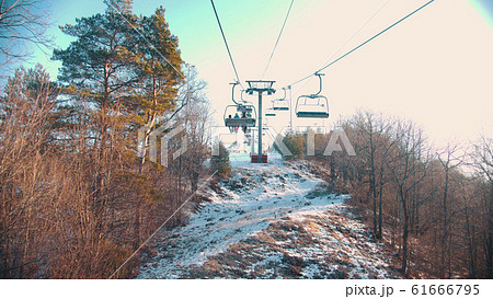 Funicular reaching the station - people sitting in the cabins and enjoying the view Funicular reaching the station - people sitting in the cabins and enjoying the view 61666795