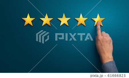 Hand of client giving a five star rating on blue background 61666823