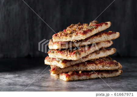 coc de tomata, a spanish pie with tomato and tuna. 61667971