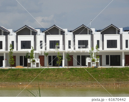 New double story luxury terrace house under construction in Malaysia.  Designed by an architect with a modern and contemporary style.  61670442