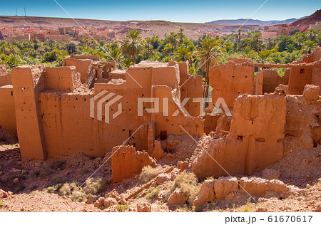 Ancient kasbah ruins and palm oasis in Tinghir Morocco Ancient kasbah ruins and palm oasis in Tinghir Morocco 61670617