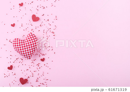 Red hearts on pink background 61671319