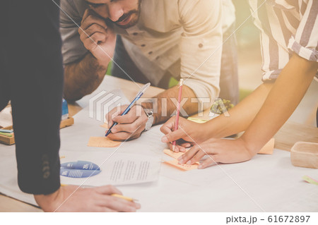 Young Business team is working on chart and sheet 61672897