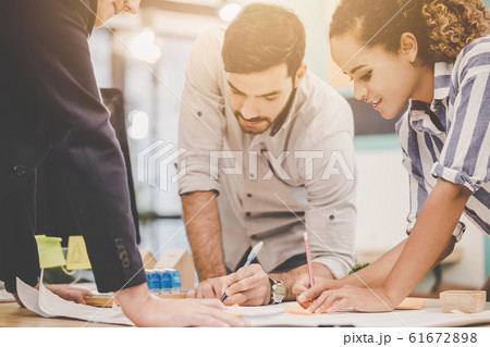 Team of young Architect Designer is brainstorming 61672898