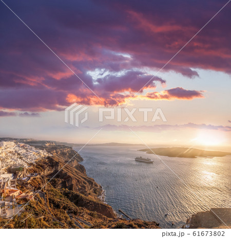 Old Town Thira on the Santorini island, famous churches against colorful sunset in Greece 61673802