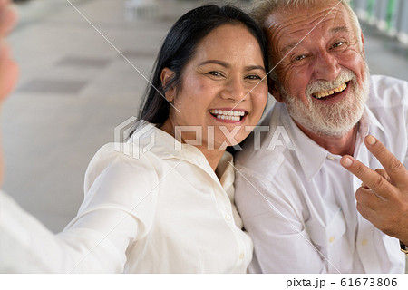 Mature multi-ethnic couple happy and in love while exploring the Mature multi-ethnic couple happy and in love while exploring the 61673806