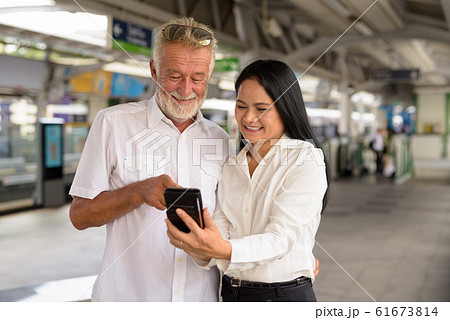 Mature multi-ethnic couple happy and in love while exploring the Mature multi-ethnic couple happy and in love while exploring the 61673814