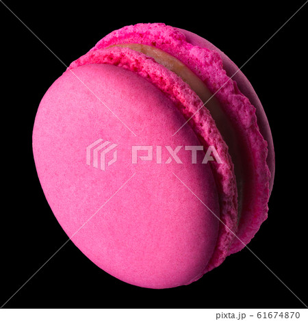 Macro photo of french pink rose macaroon isolated on black with clipping path 61674870