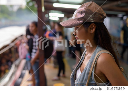Young beautiful Asian tourist woman exploring the city of Bangko Young beautiful Asian tourist woman exploring the city of Bangko 61675869
