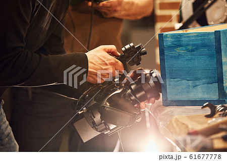 Behind the scenes of video production or video shooting, Film grain, selective focus, special illumination Behind the scenes of video production or video shooting, Film grain, selective focus, special illumination 61677778