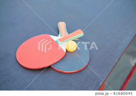 rackets and ball on Ping pong table in outdoor rackets and ball on Ping pong table in outdoor 61680045