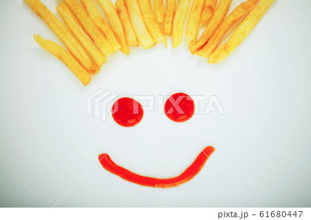 Diet. Funny Face. Golden Frost Potato on White Background. Dieto 61680447