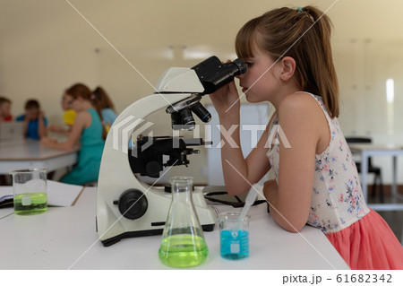 Elementary school girl in chemistry class 61682342