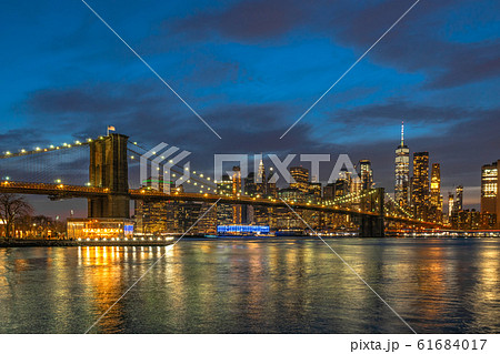 scene of New york Cityscape with Brooklyn Bridge over the east river at the twilight time, USA downtown skyline, Architecture and transportation concept 61684017