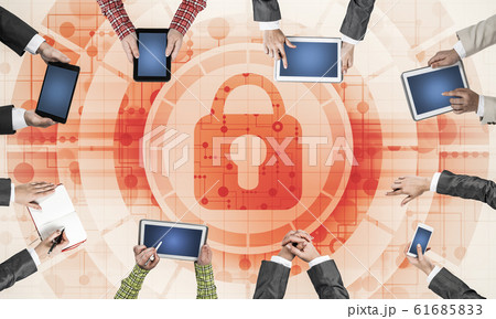 Top view of businesspeople sitting at table and using gadgets Top view of businesspeople sitting at table and using gadgets 61685833